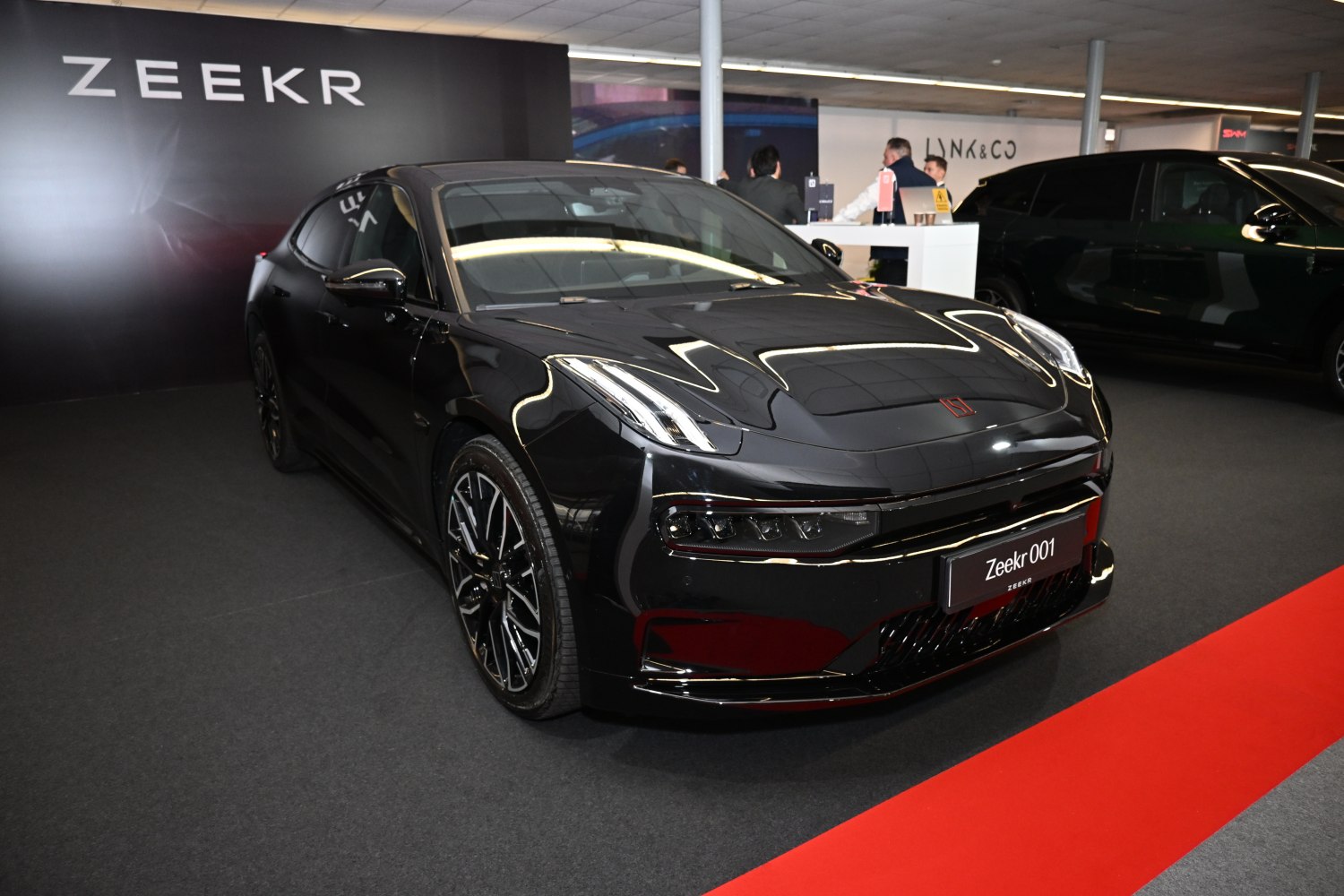 Front view of electric sedan with LED headlights and aerodynamic styling