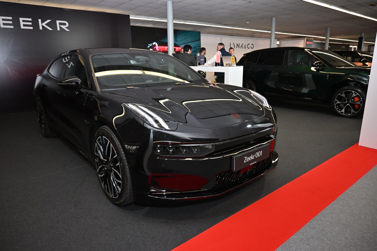 Front view of sleek electric sedan with aerodynamic design and LED headlights