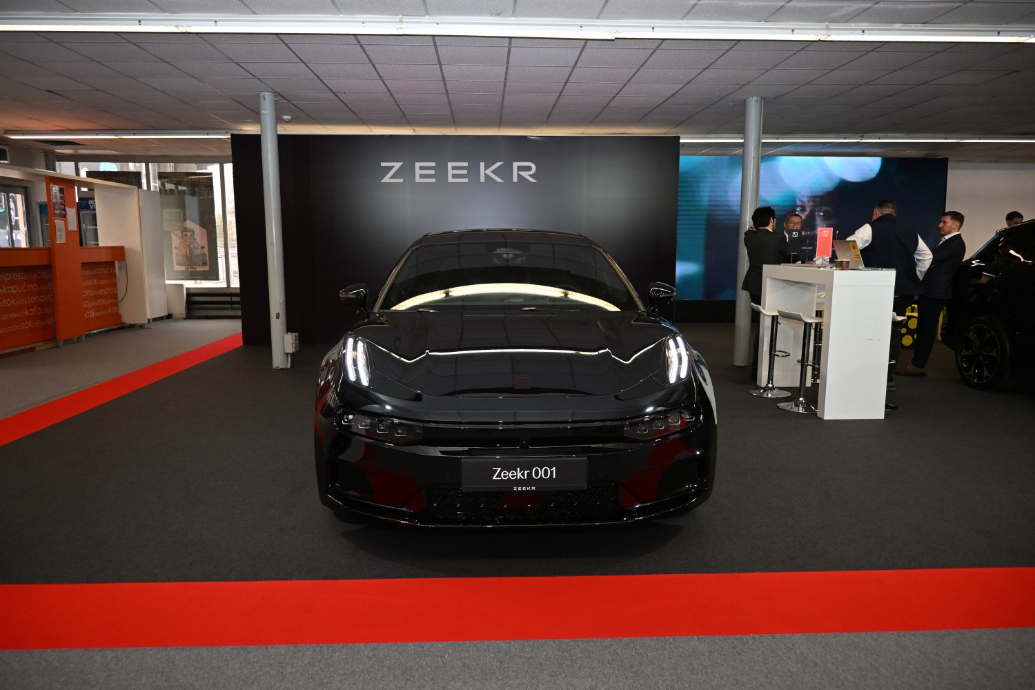 Front view featuring sleek LED headlights and aerodynamic hood design.