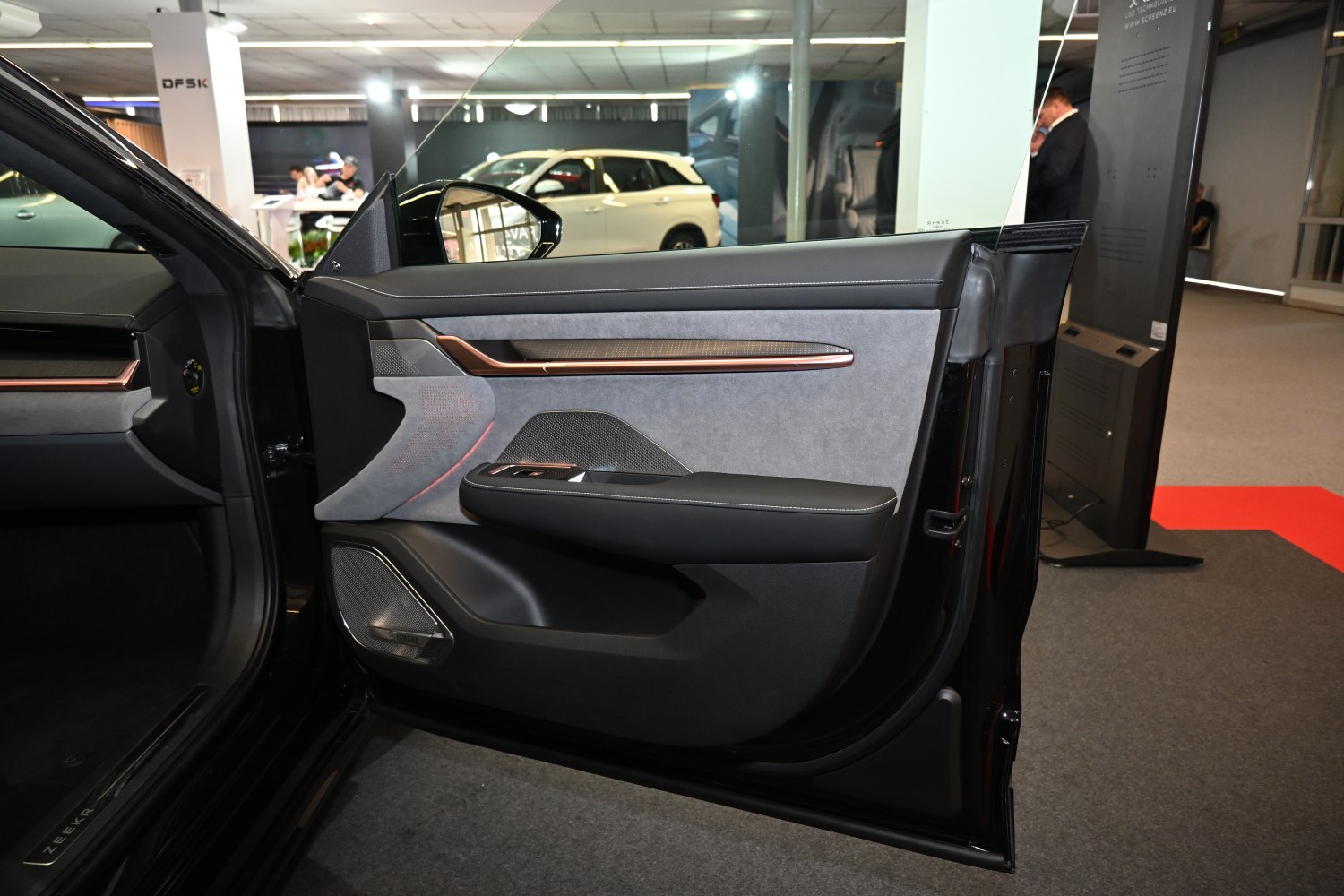Car door panel with integrated speakers and premium trim