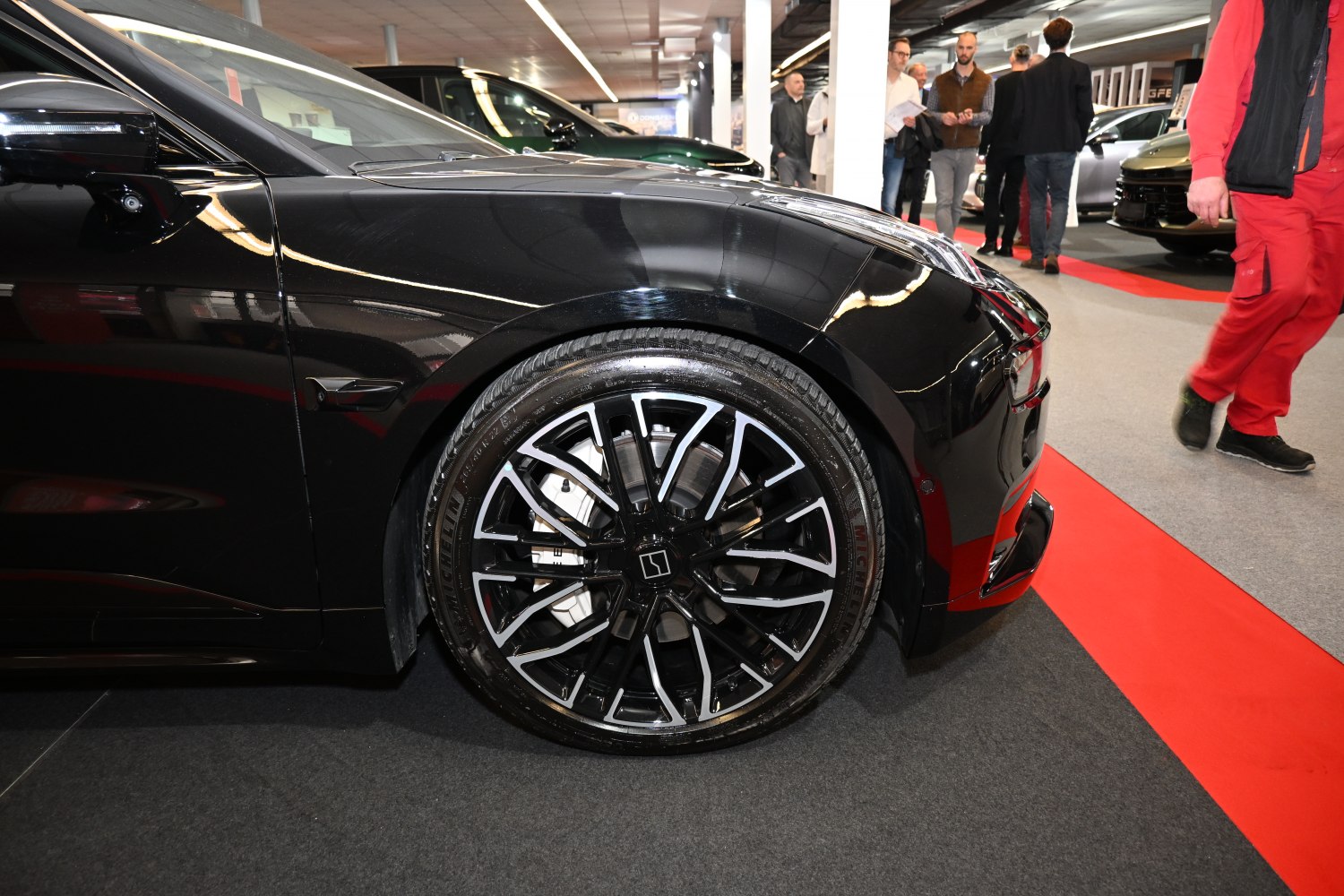 Front wheel and black fender with intricate alloy rim design