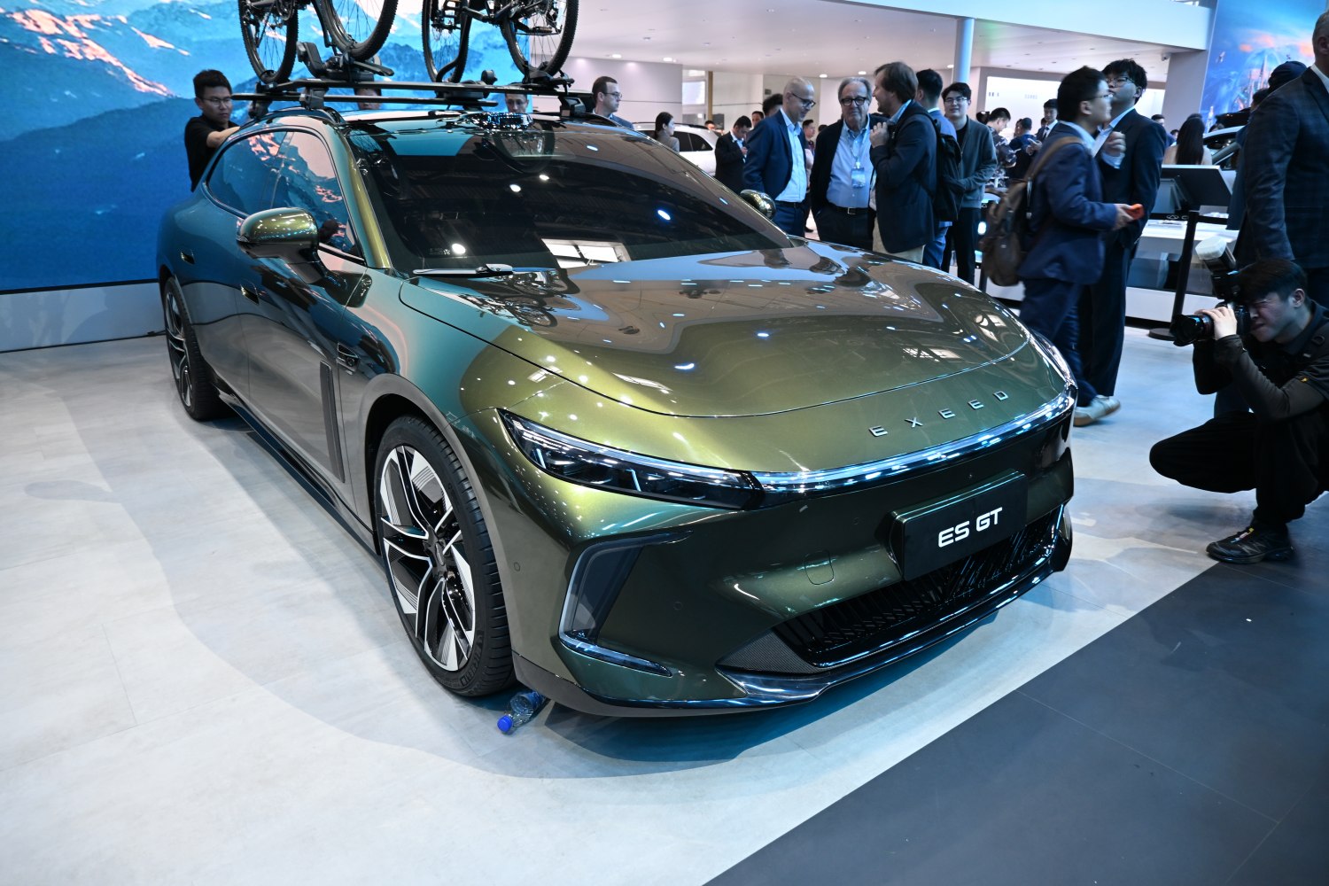 Front view of SUV with roof-mounted bike rack and sleek headlights