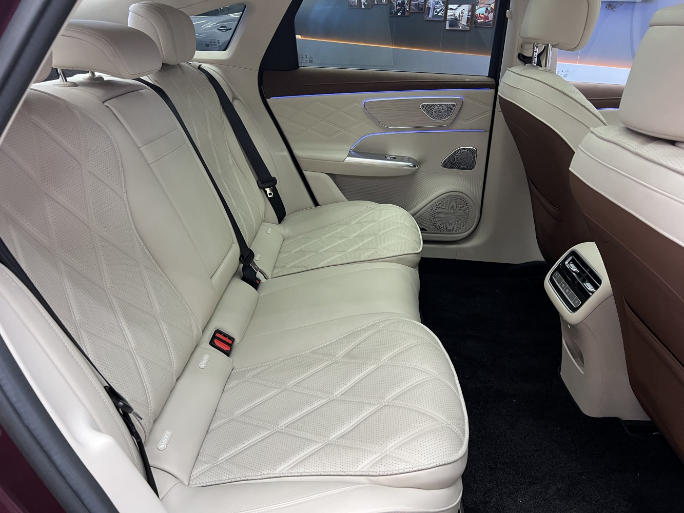 Quilted cream leather rear seats with ambient lighting and rear air vents.