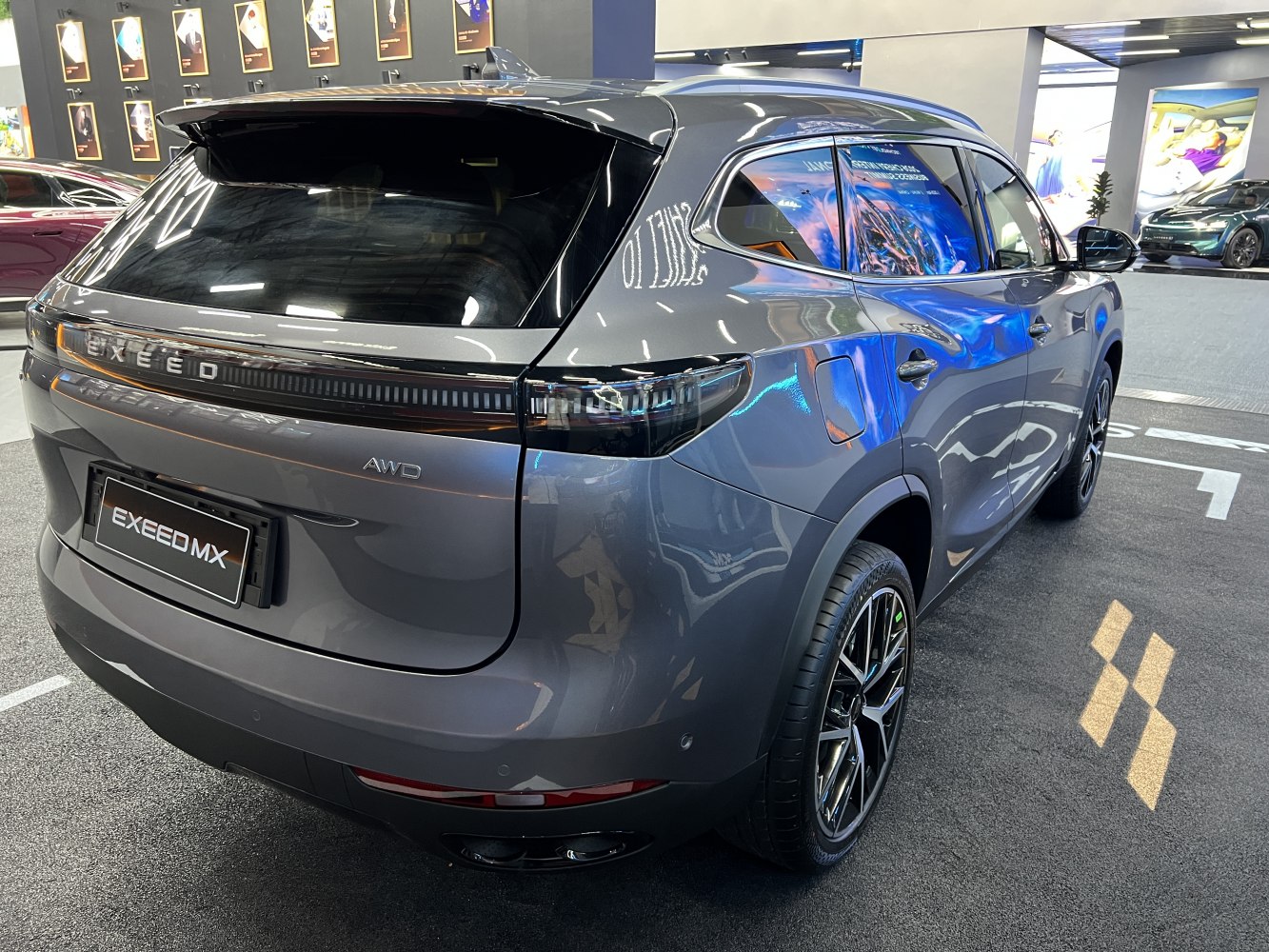 Rear and side exterior with sleek taillights and aerodynamic design