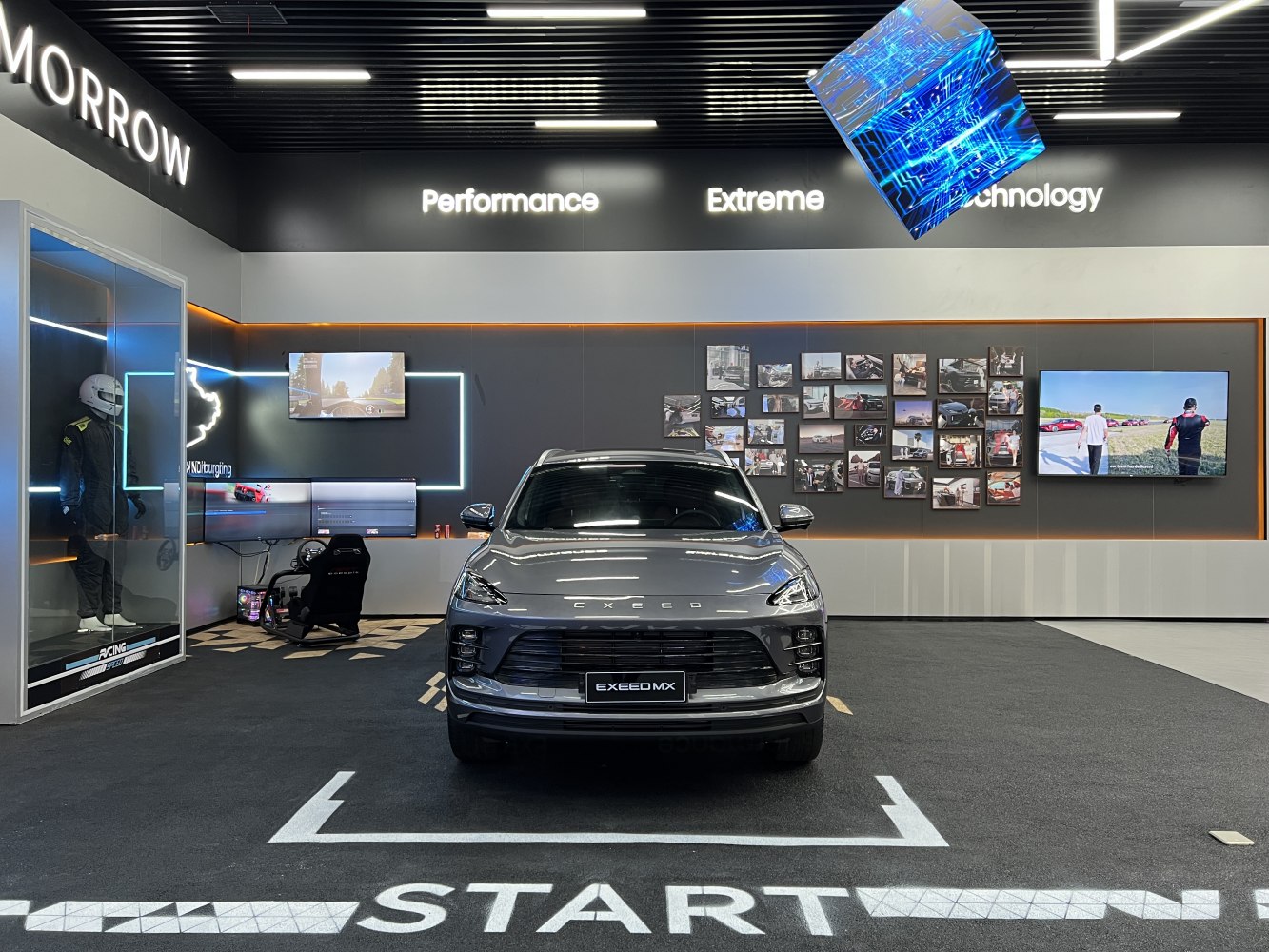 Front view of a grey modern SUV with racing simulator setup in a futuristic display