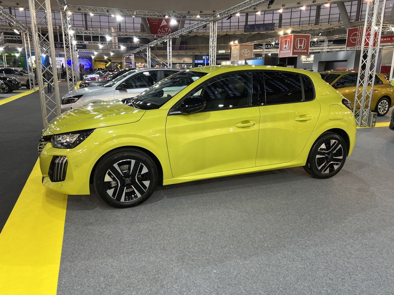 Side profile of compact hatchback with modern alloy wheels