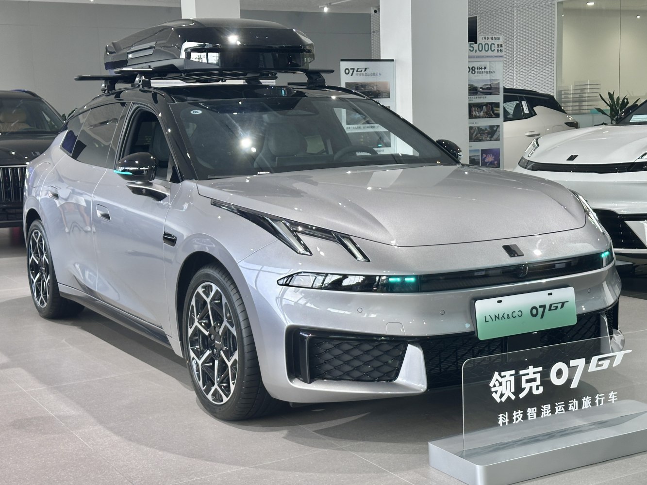 Sporty vehicle with distinctive headlights and roof cargo box