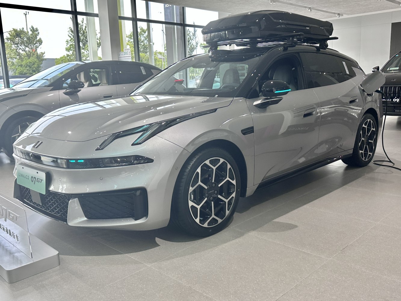 Electric crossover charging with roof cargo box and unique wheels
