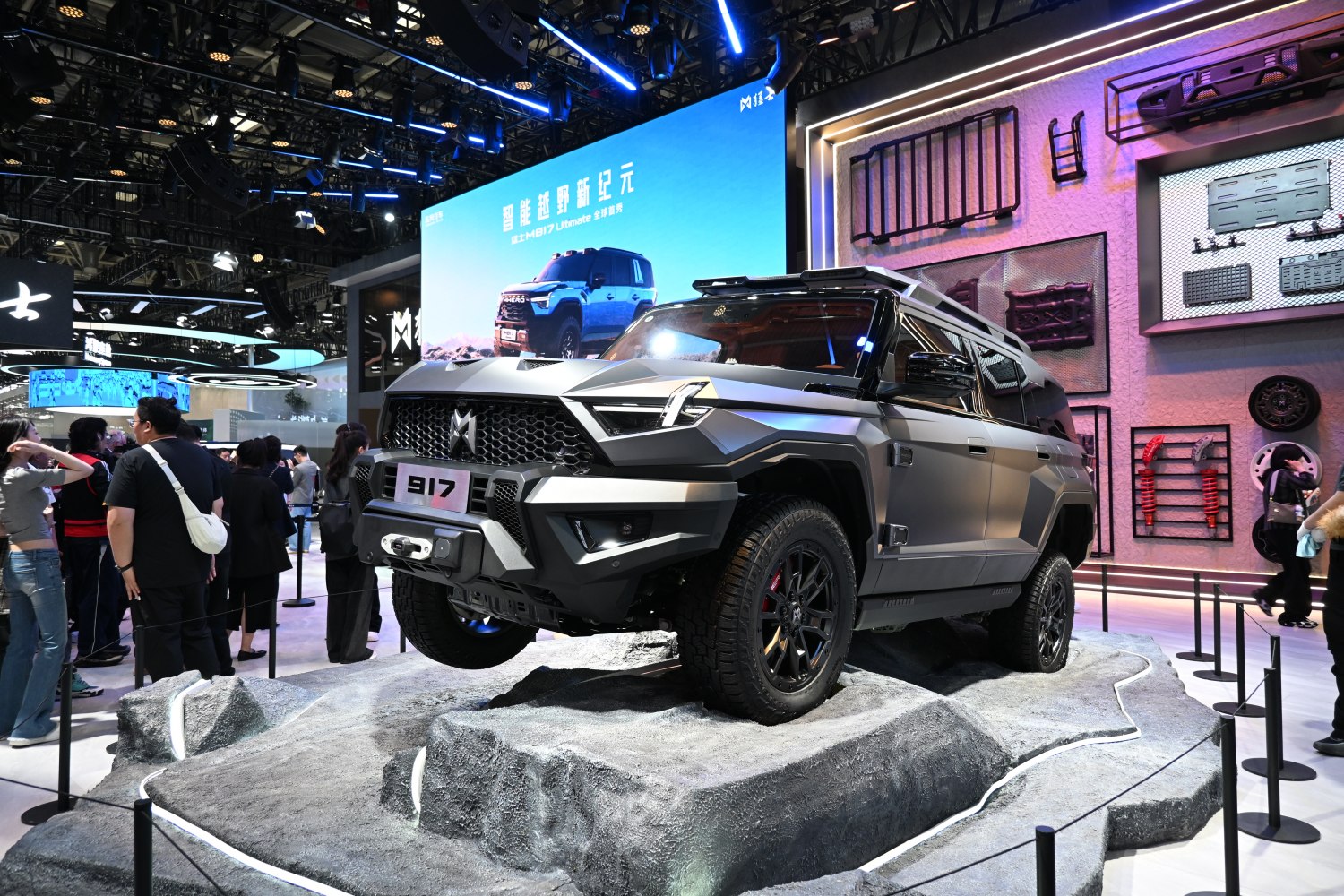 Bold angular SUV design on rugged display terrain