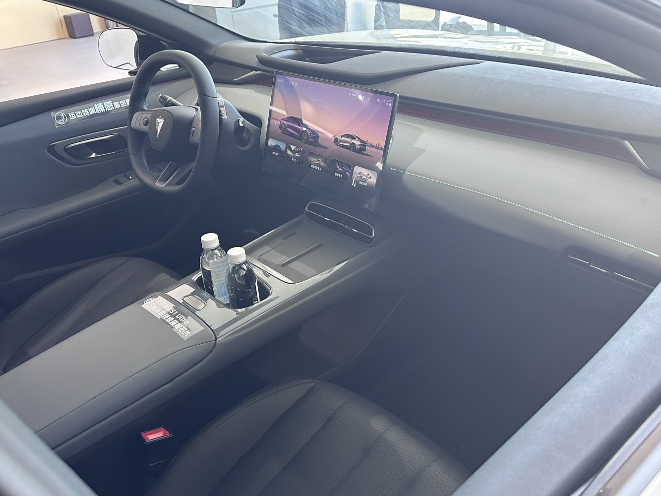 Modern car interior with large central touchscreen and minimalistic dashboard