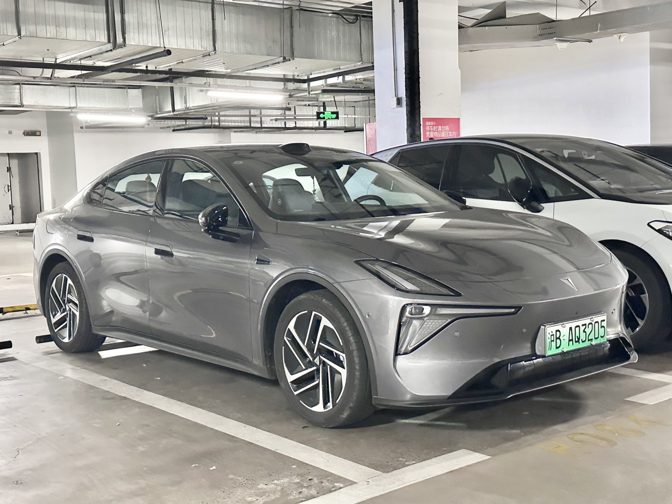 Modern electric sedan with futuristic LED headlights and aerodynamic design