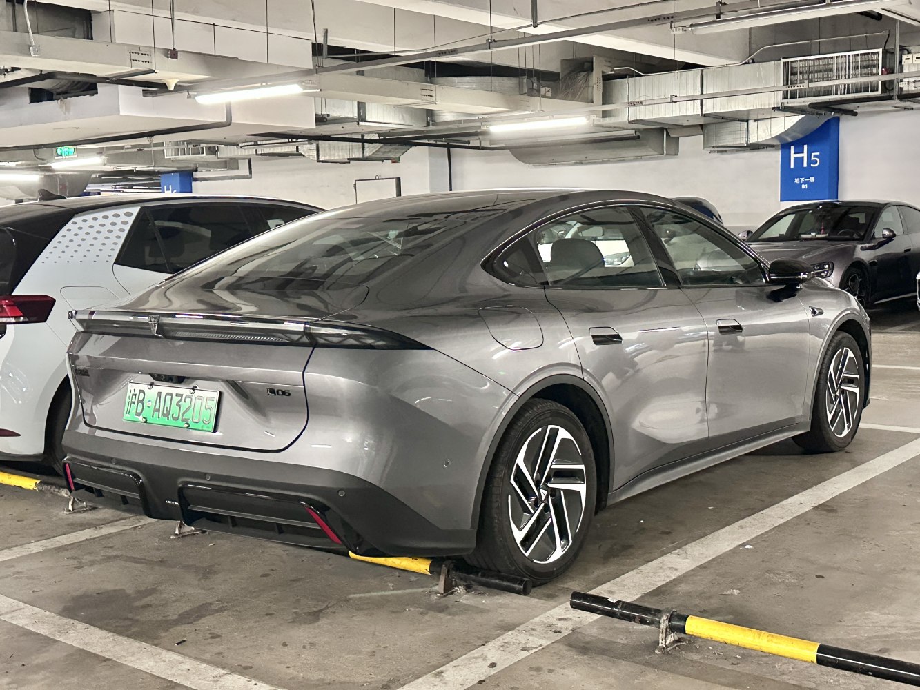 Sleek sedan rear with integrated LED tail light, aerodynamic curves