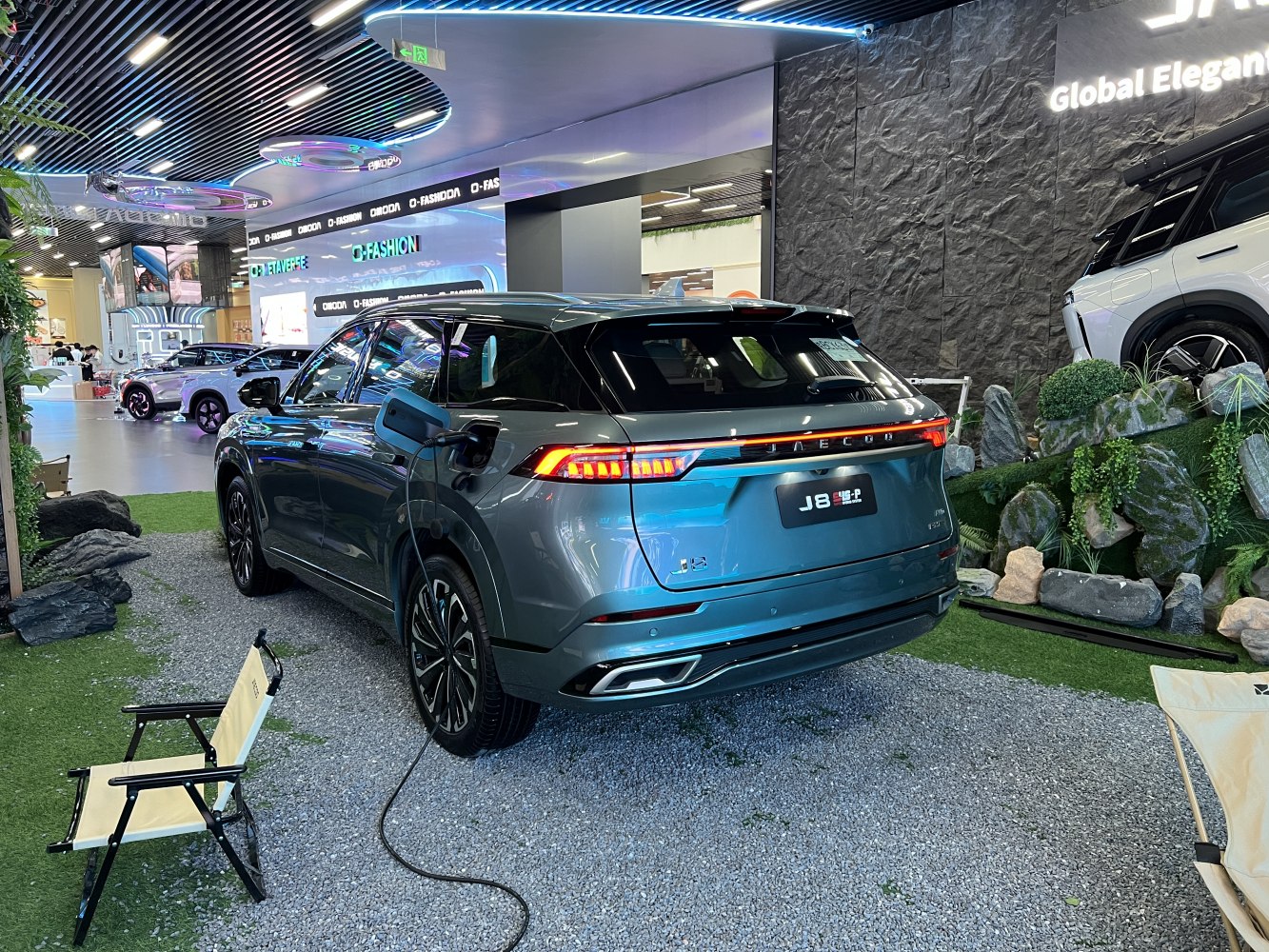 Rear of electric SUV with LED light bar and charging port