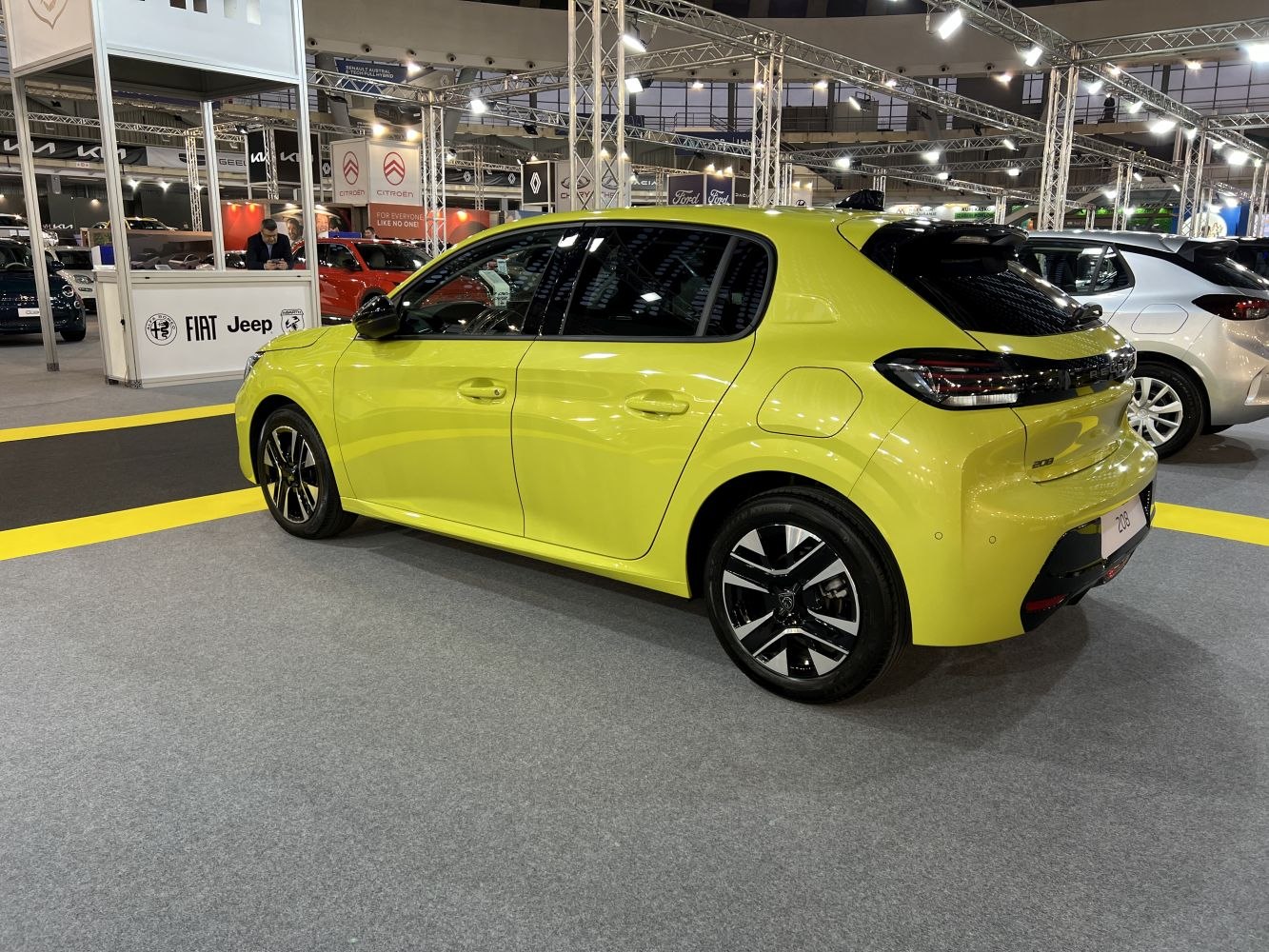 Rear side view of a modern compact hatchback with alloy wheels and sleek taillights.