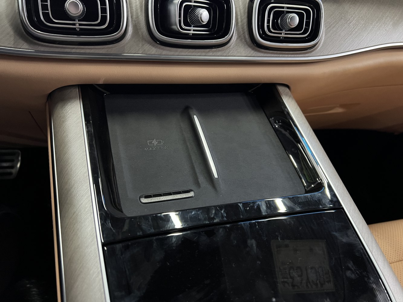 Wireless charging pad and unique rectangular air vents with chrome accents