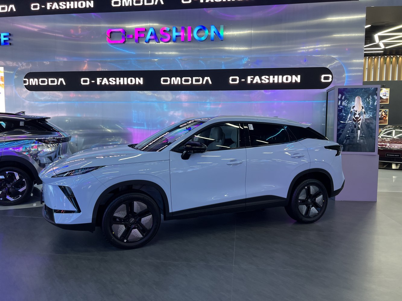 White futuristic SUV with black roof and unique aero wheels
