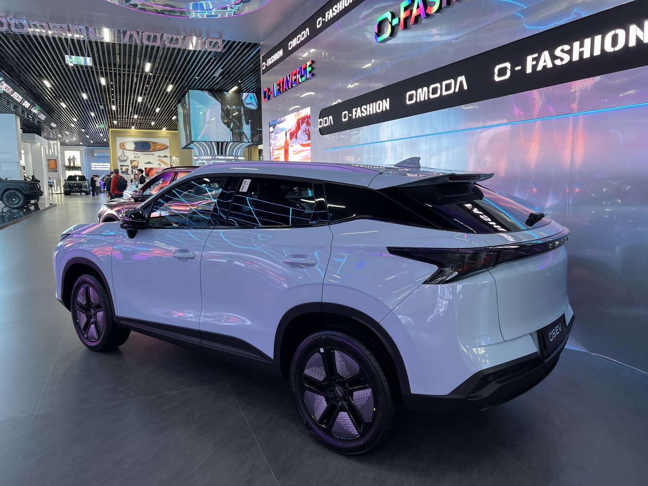 Rear and side view with sporty spoiler in showroom