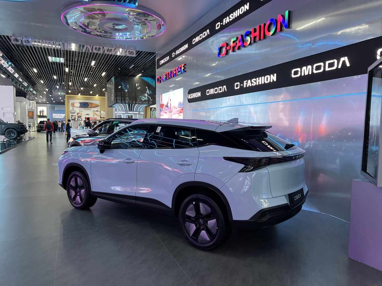 Rear and side view of sleek modern SUV with tinted windows and black trim