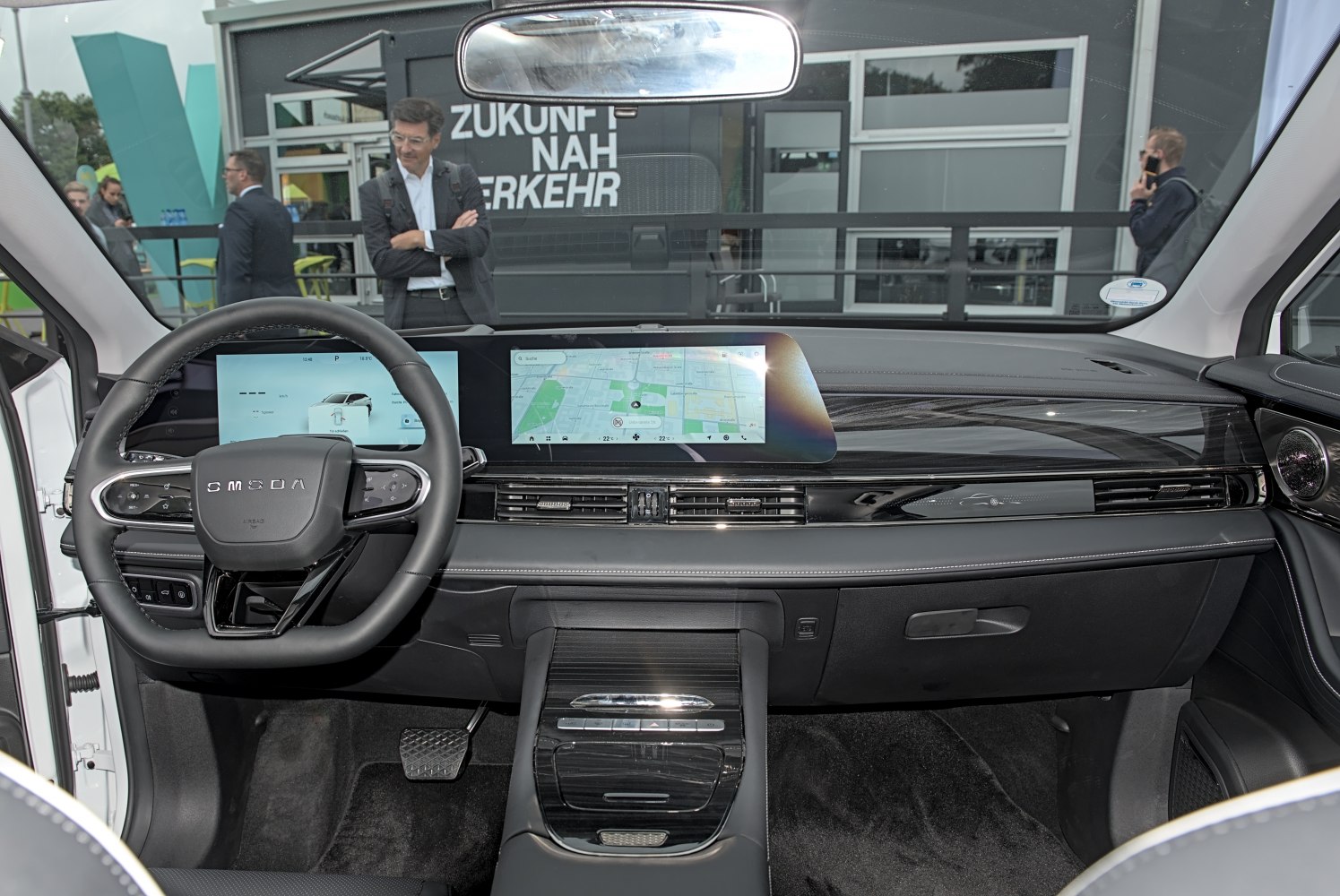 Steering wheel and dual digital screens on modern dashboard