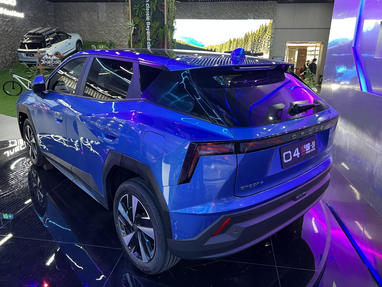 Sleek rear design with sharp angles and LED tail lights on modern blue SUV