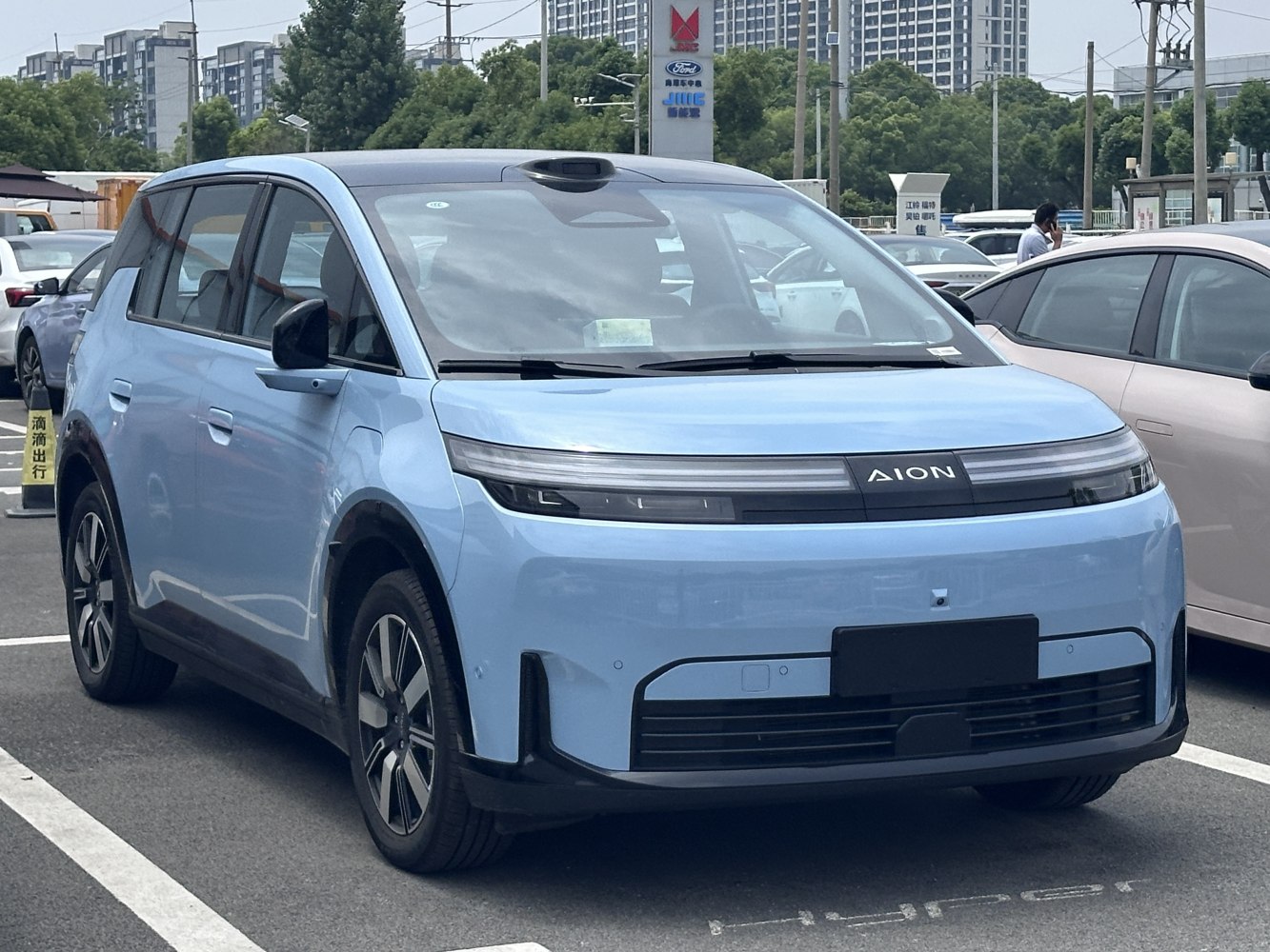 Futuristic electric crossover front with LED headlights and sensor technology