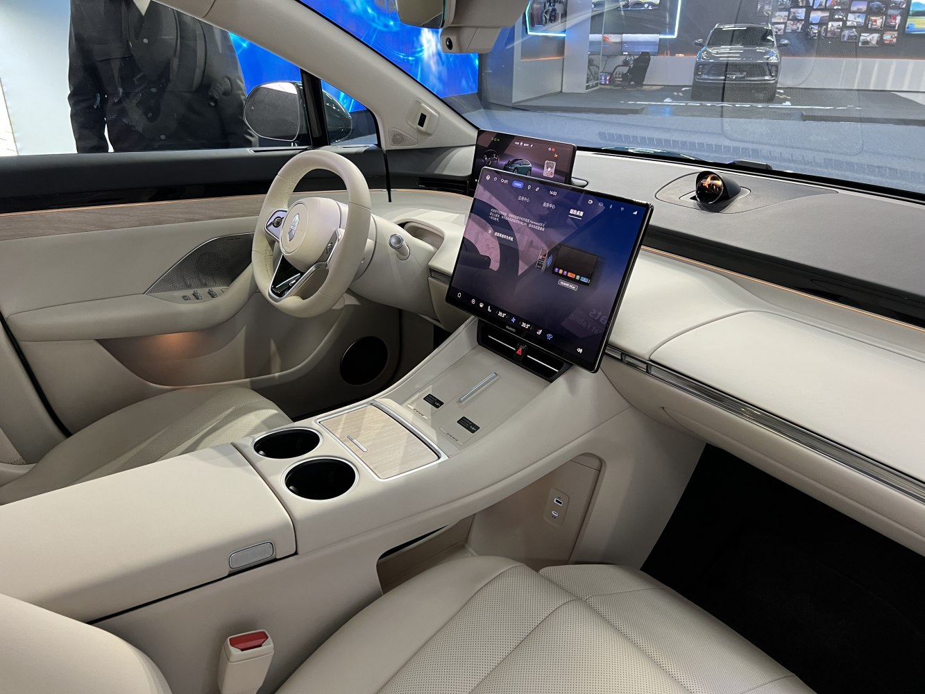 Modern car interior with large central touchscreen and digital driver display