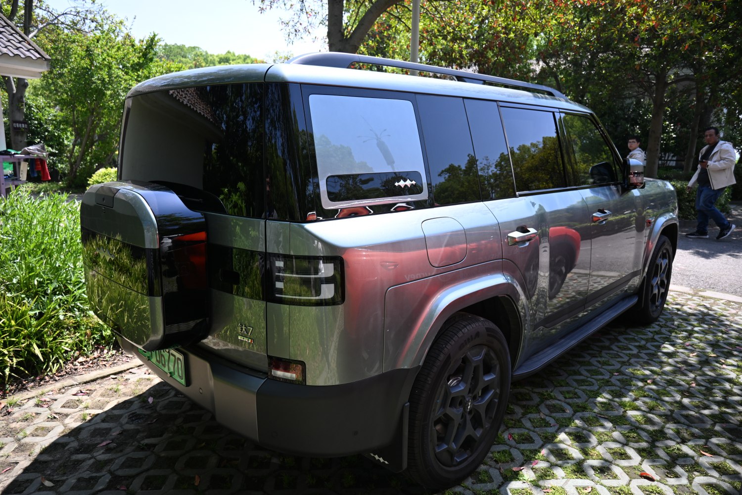 SUV rear view with rear-mounted spare wheel and angular tail lights