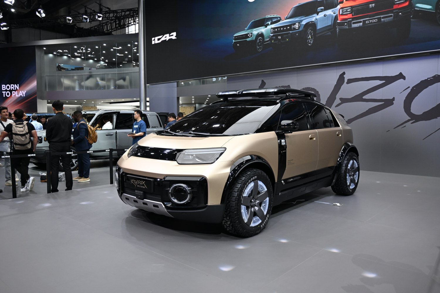Futuristic SUV front fascia and rugged tires in auto show setting
