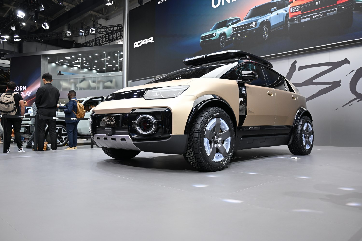 Modern SUV with roof rack and all-terrain tires