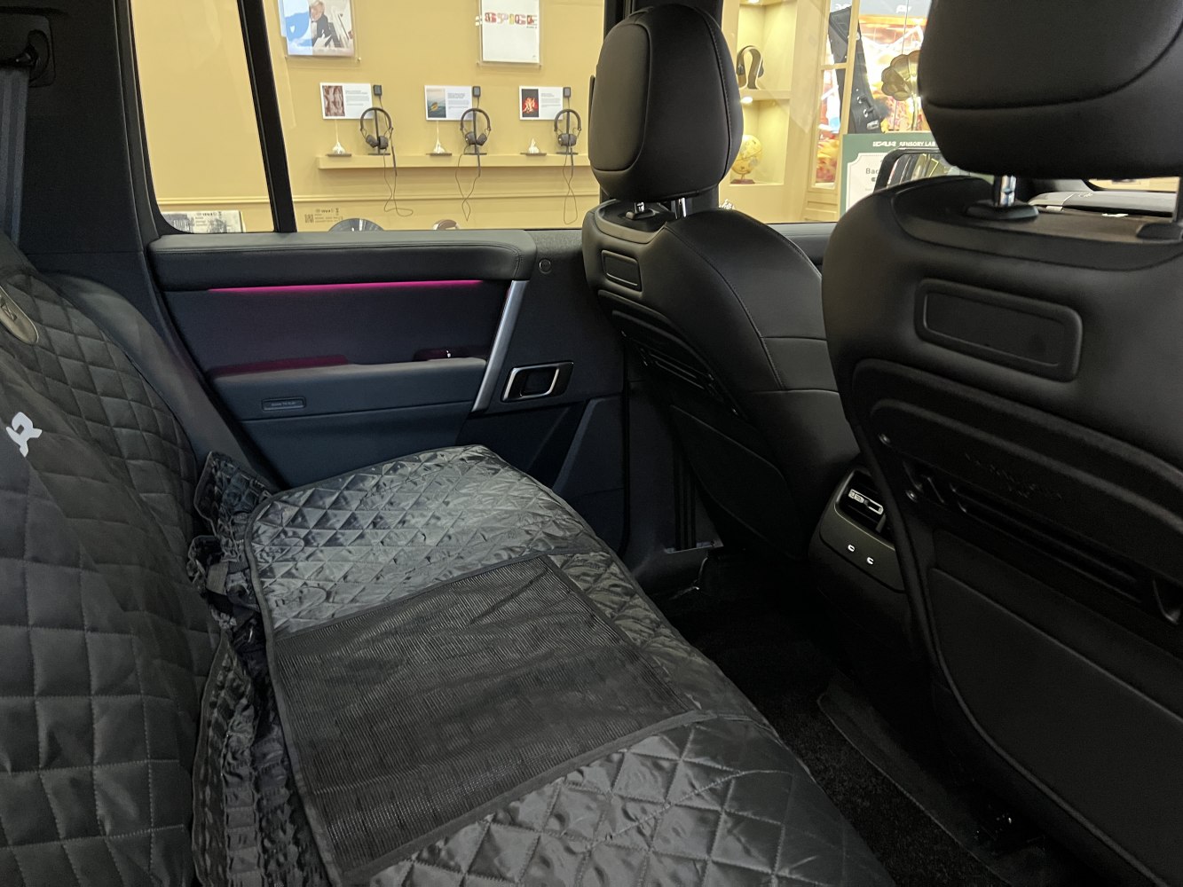 Quilted rear seat covers with ambient lighting