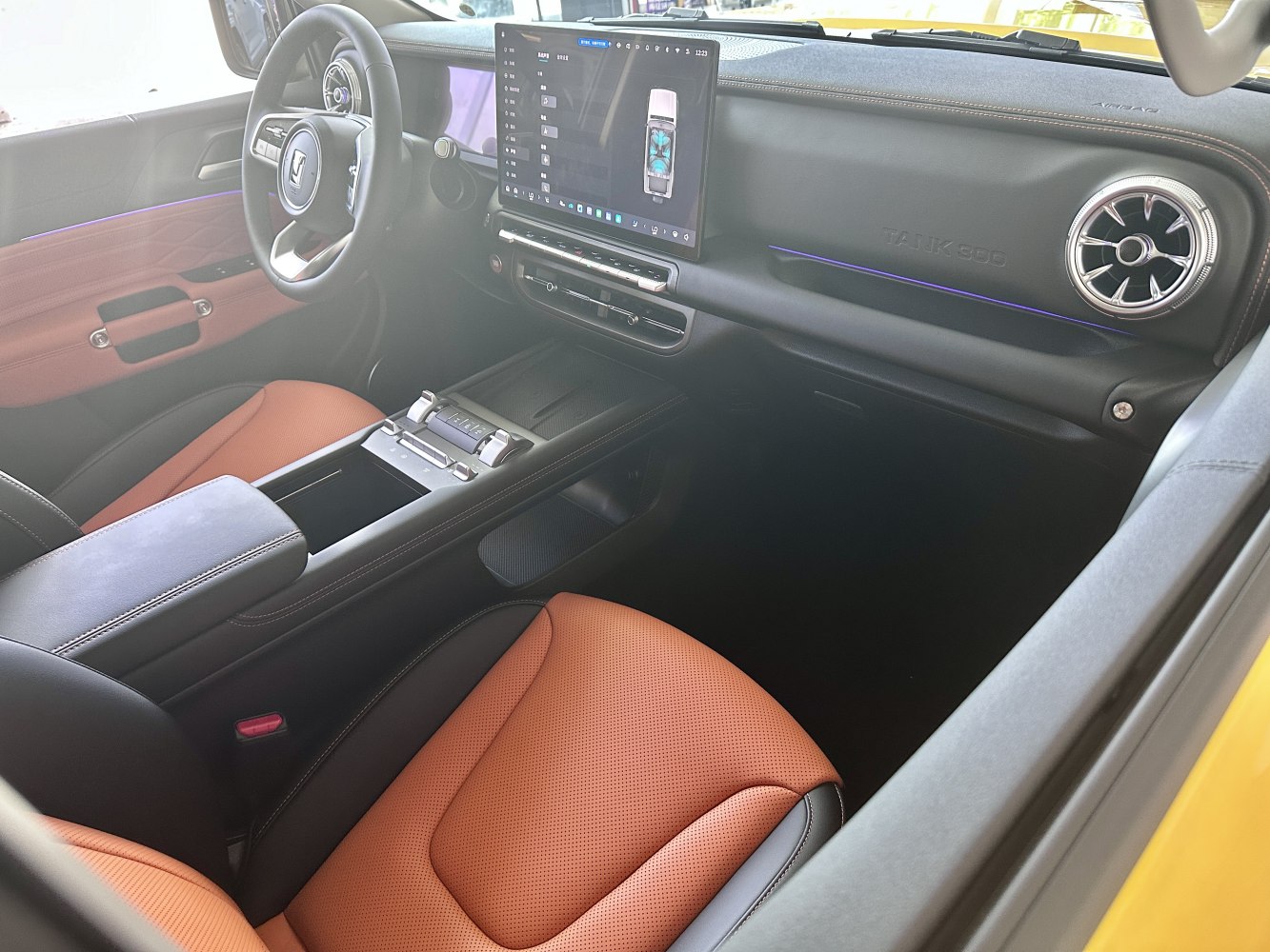 Digital dashboard and touchscreen in luxury SUV interior with leather seats and modern steering wheel