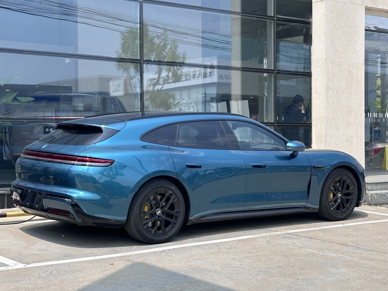 Electric sports wagon with fastback style and aerodynamic rear profile