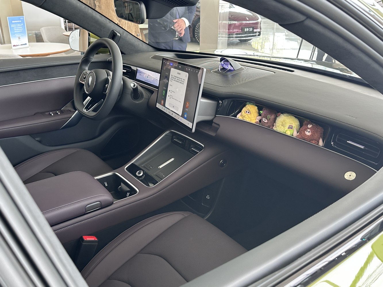 Dual digital displays and plush dashboard with decorative stuffed toys