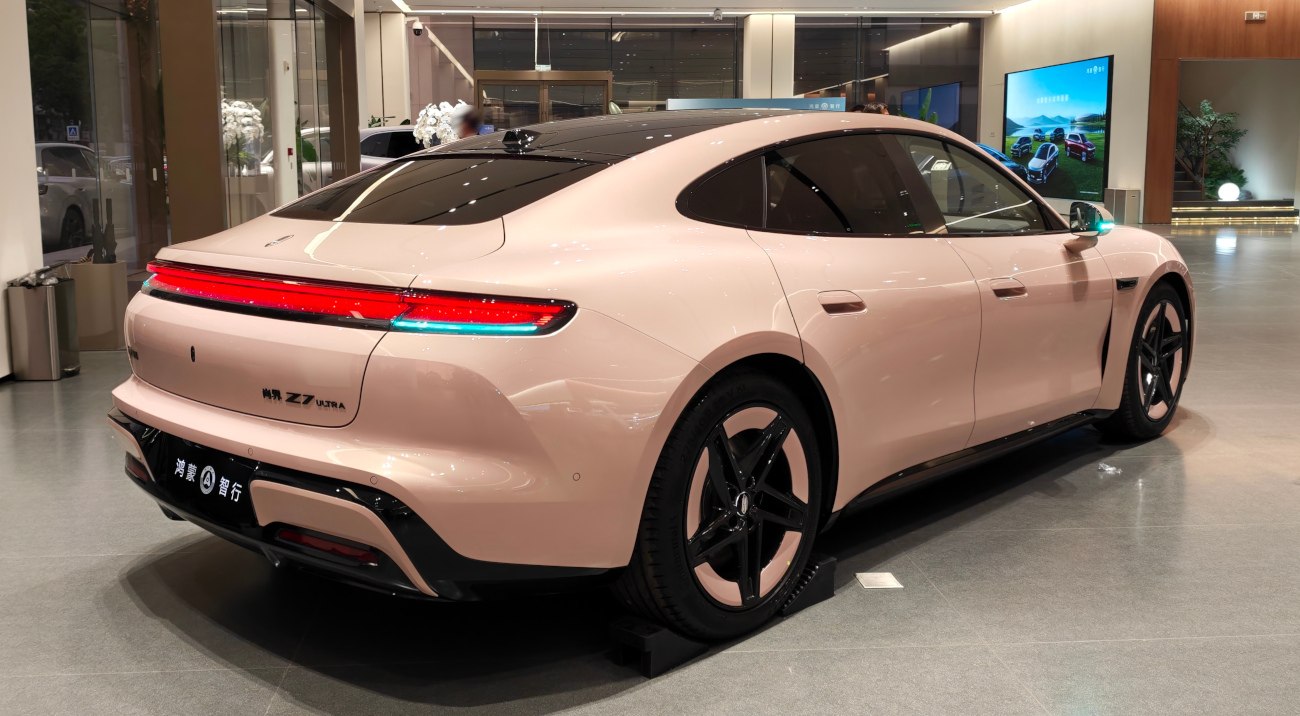 Rear and side profile of a sleek electric sedan with modern design.