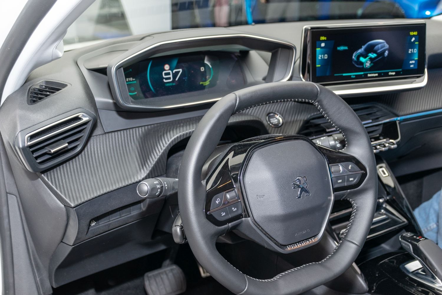 Digital instrument cluster and infotainment touchscreen inside modern car interior