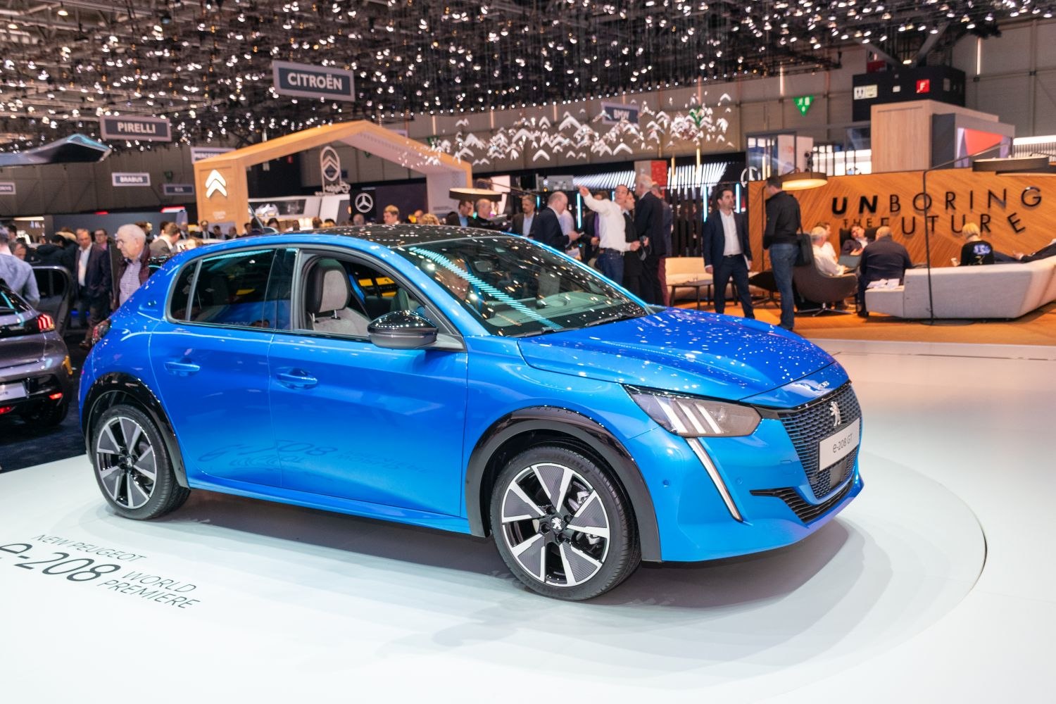 Blue compact hatchback with LED headlights and stylish alloy wheels