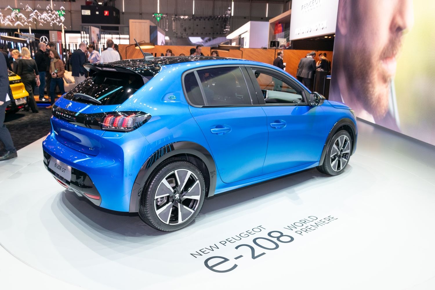 Rear side view of electric hatchback with distinctive lights and alloy wheels