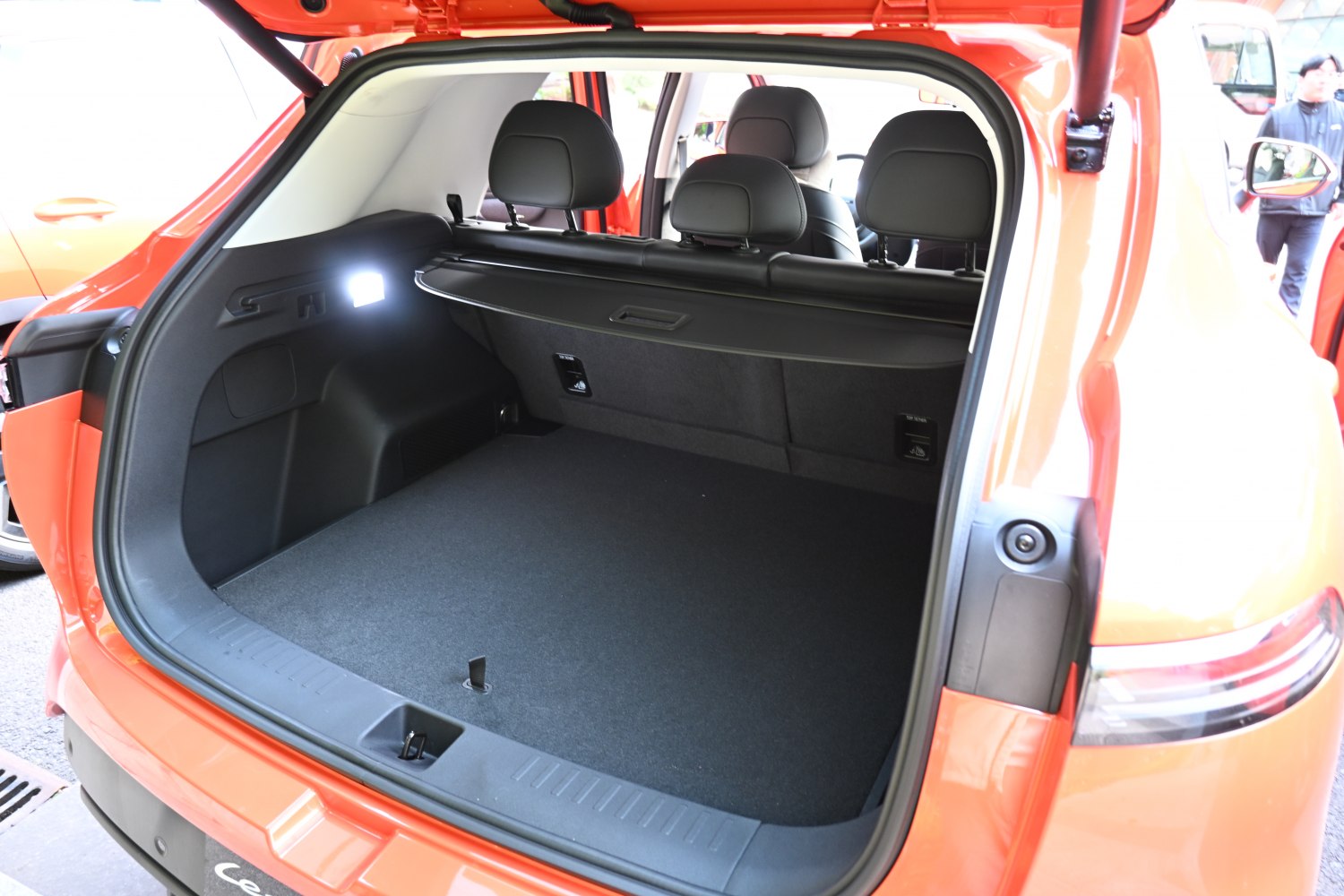 Open spacious rear trunk with visible rear seats and cargo cover