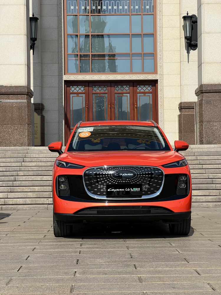 Front view with large grille and LED headlights