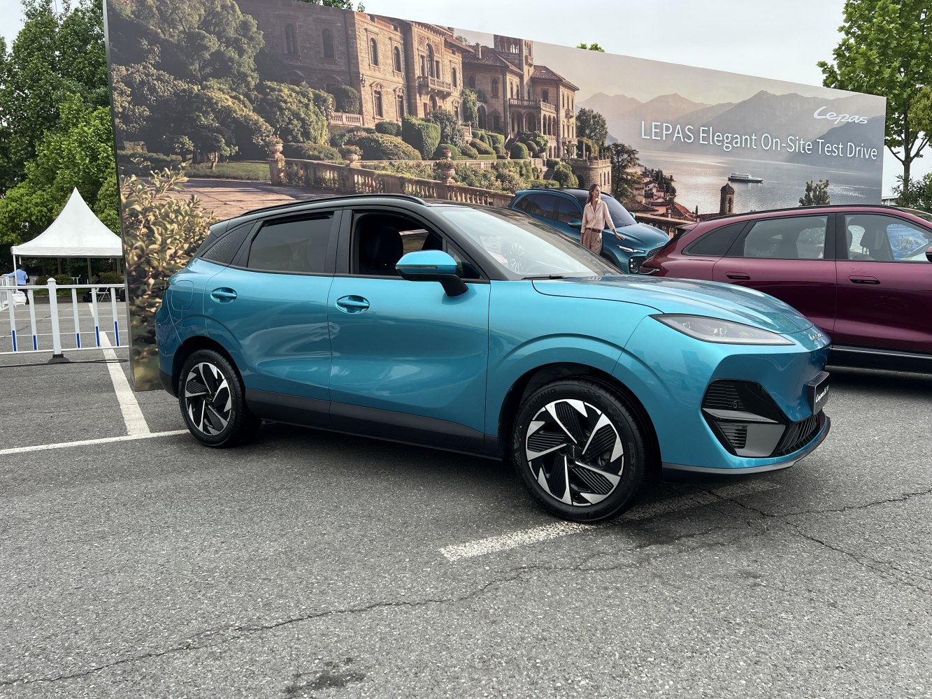 Sleek blue compact electric SUV shown from the side.