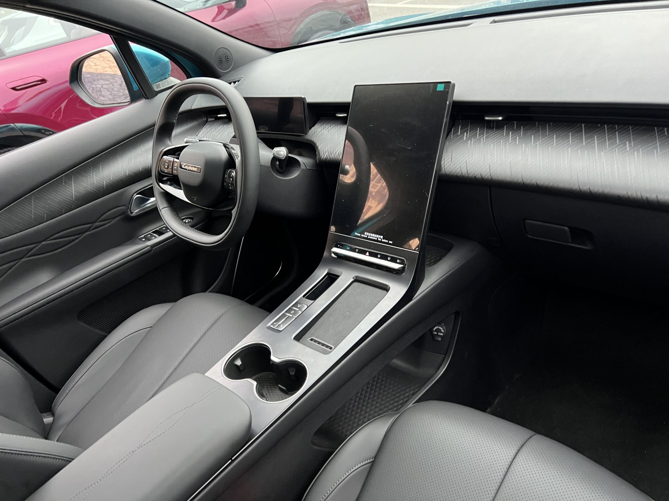 Digital dashboard and large vertical touchscreen in modern car interior