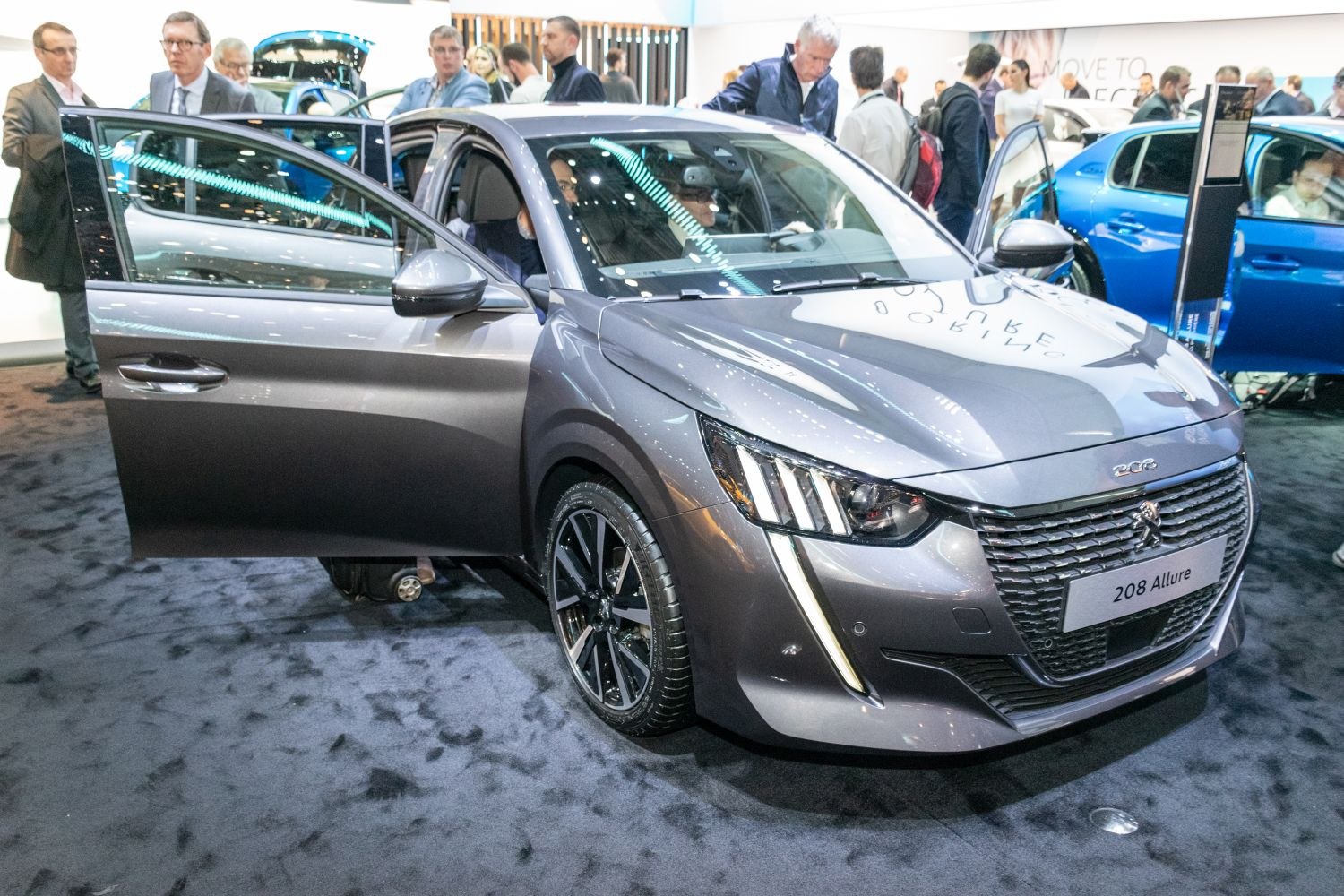 Front view of compact hatchback with distinctive LED headlights and alloy wheels.