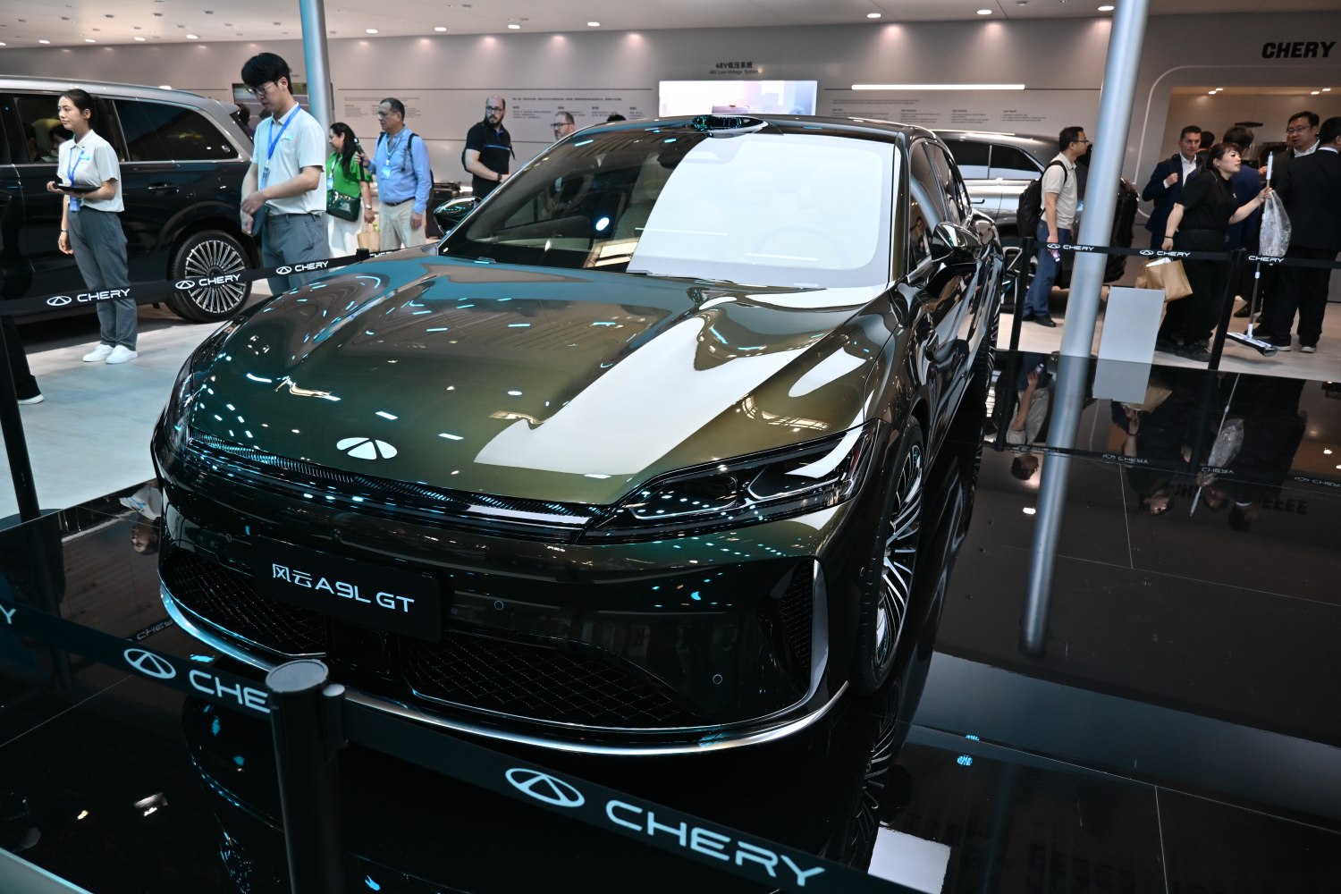 Front view of sleek sedan with modern LED headlights and high-gloss hood