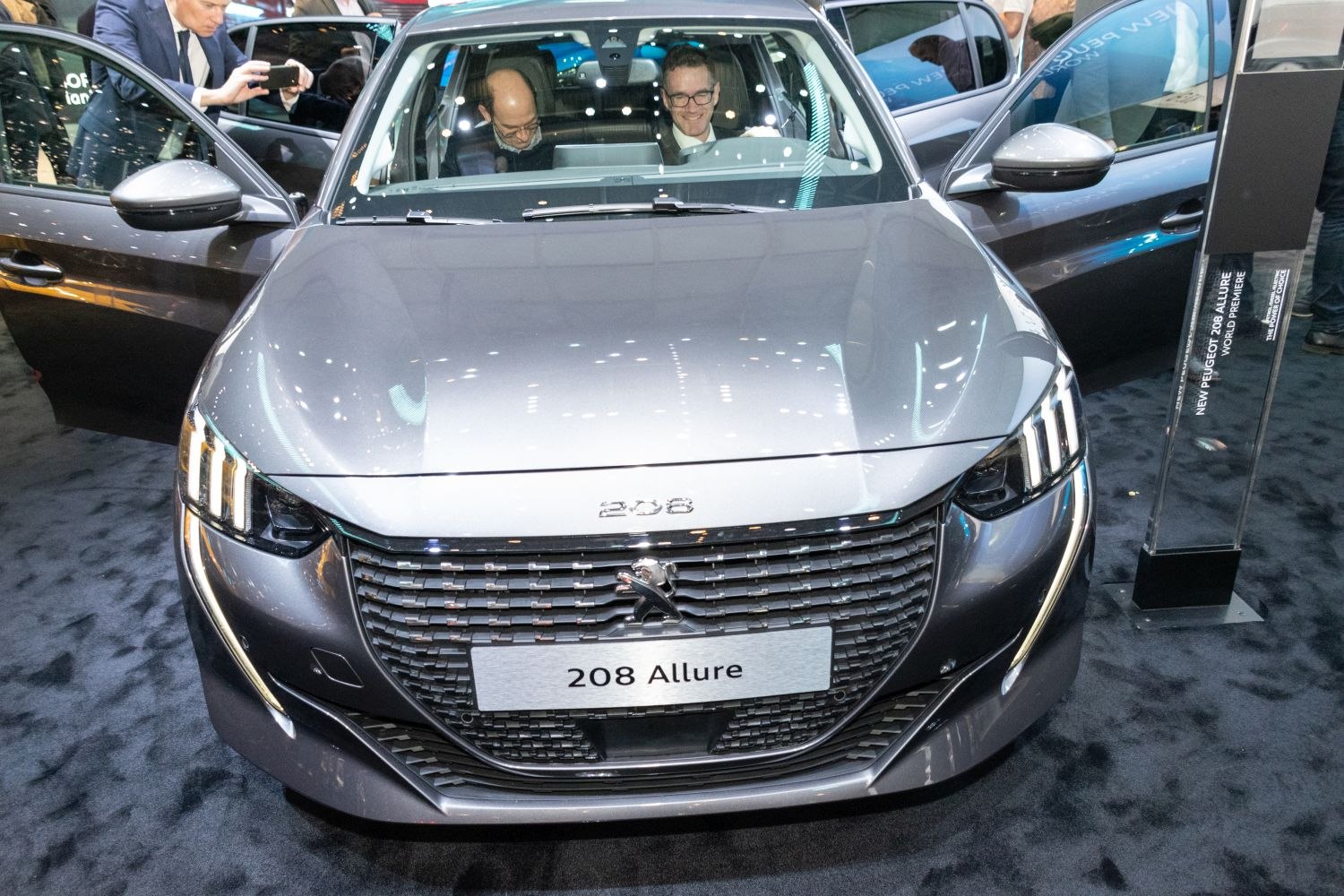 Front grille and LED headlights with open car doors