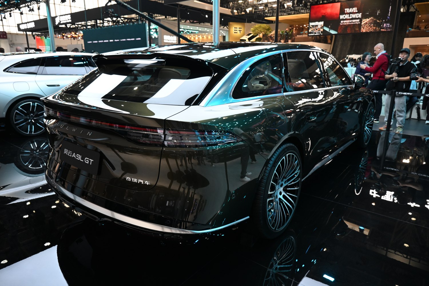 Sleek rear design with continuous tail light and multi-spoke alloy wheels