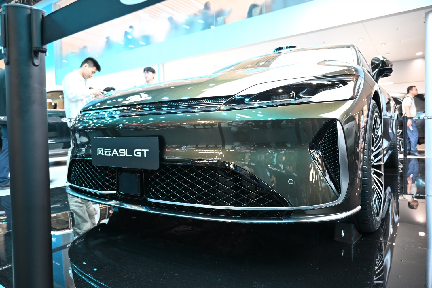 Close-up of sleek headlights and wide front grille