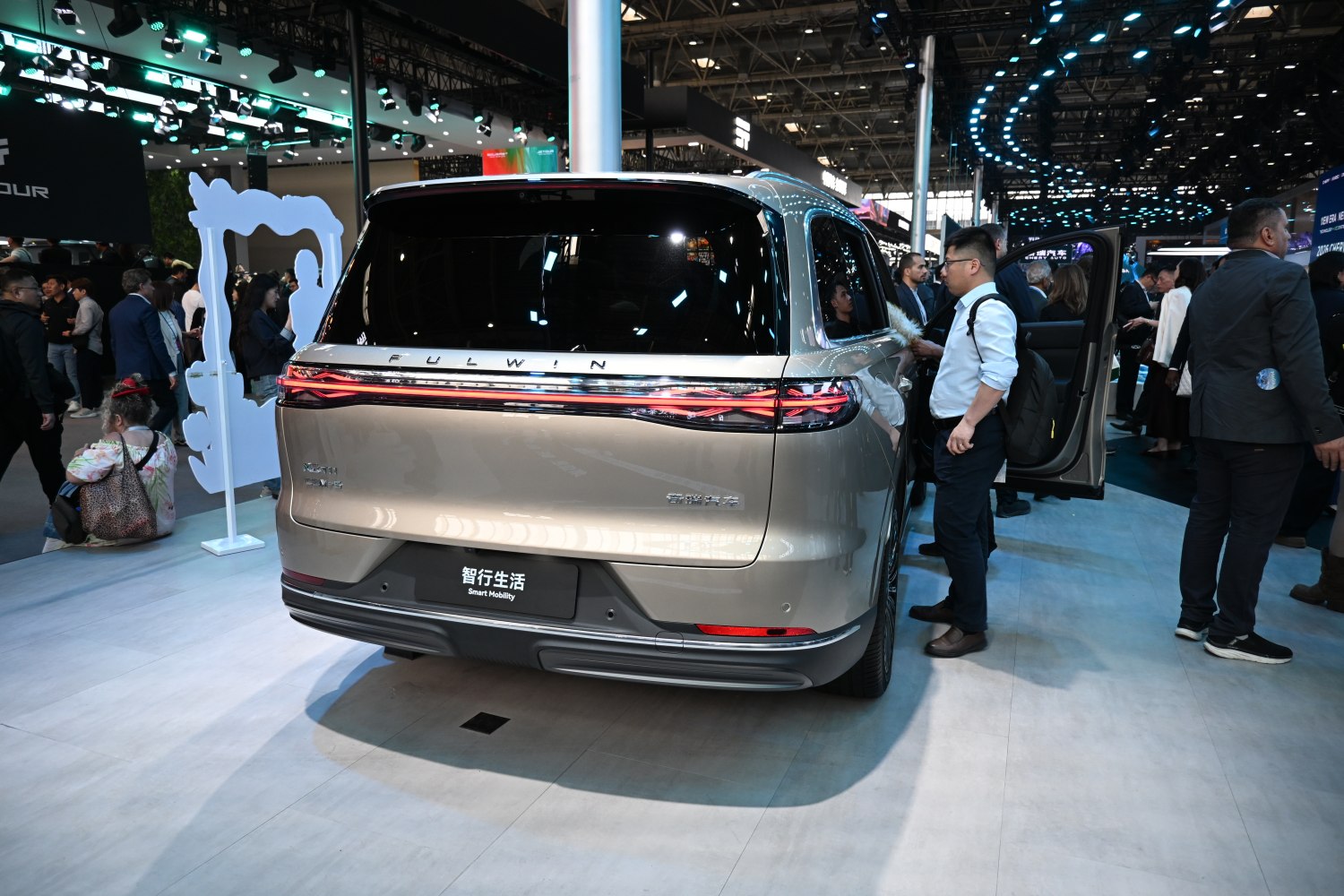 Rear view with continuous LED tail lights on vehicle.
