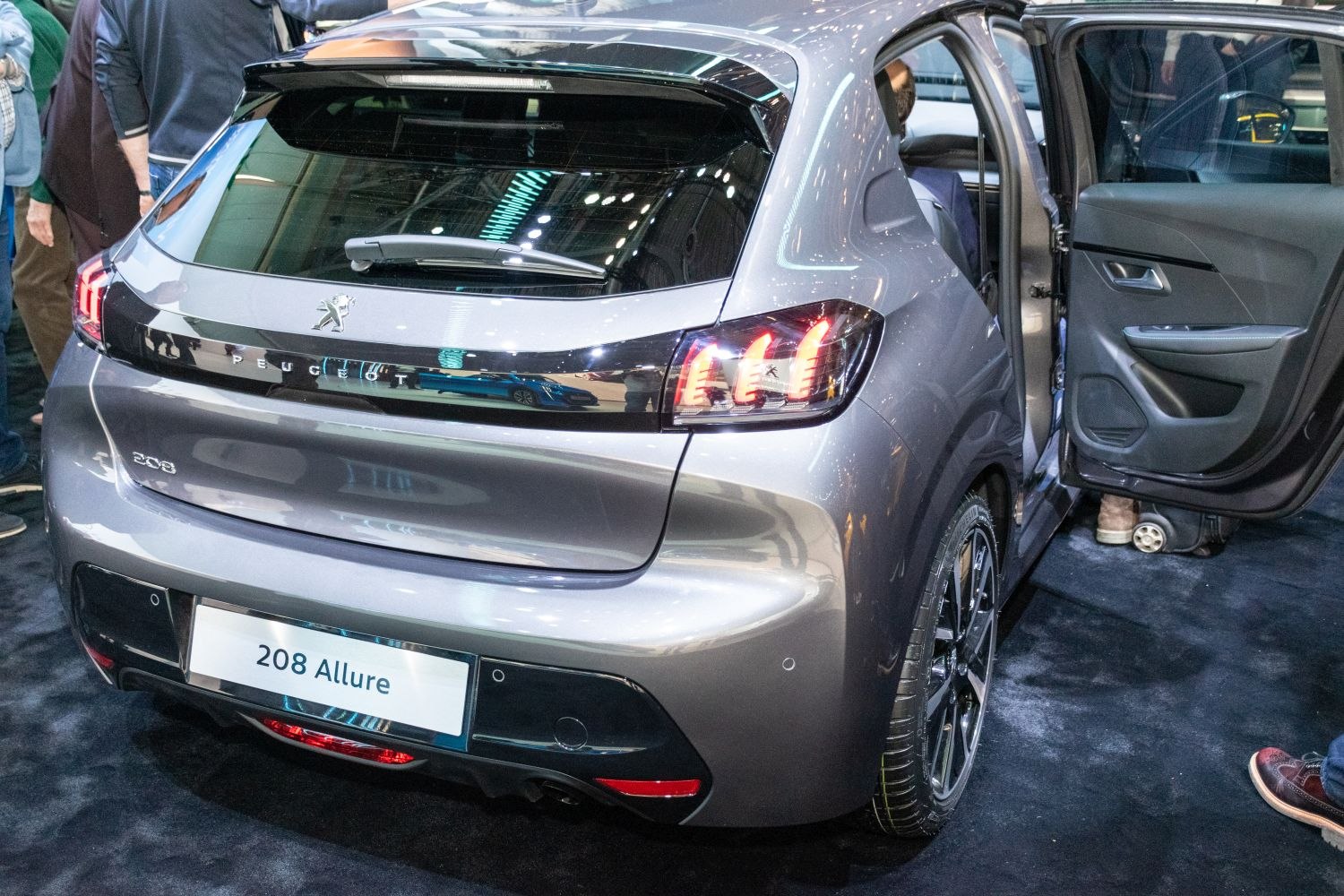 Rear hatchback view with tail lights and open rear door