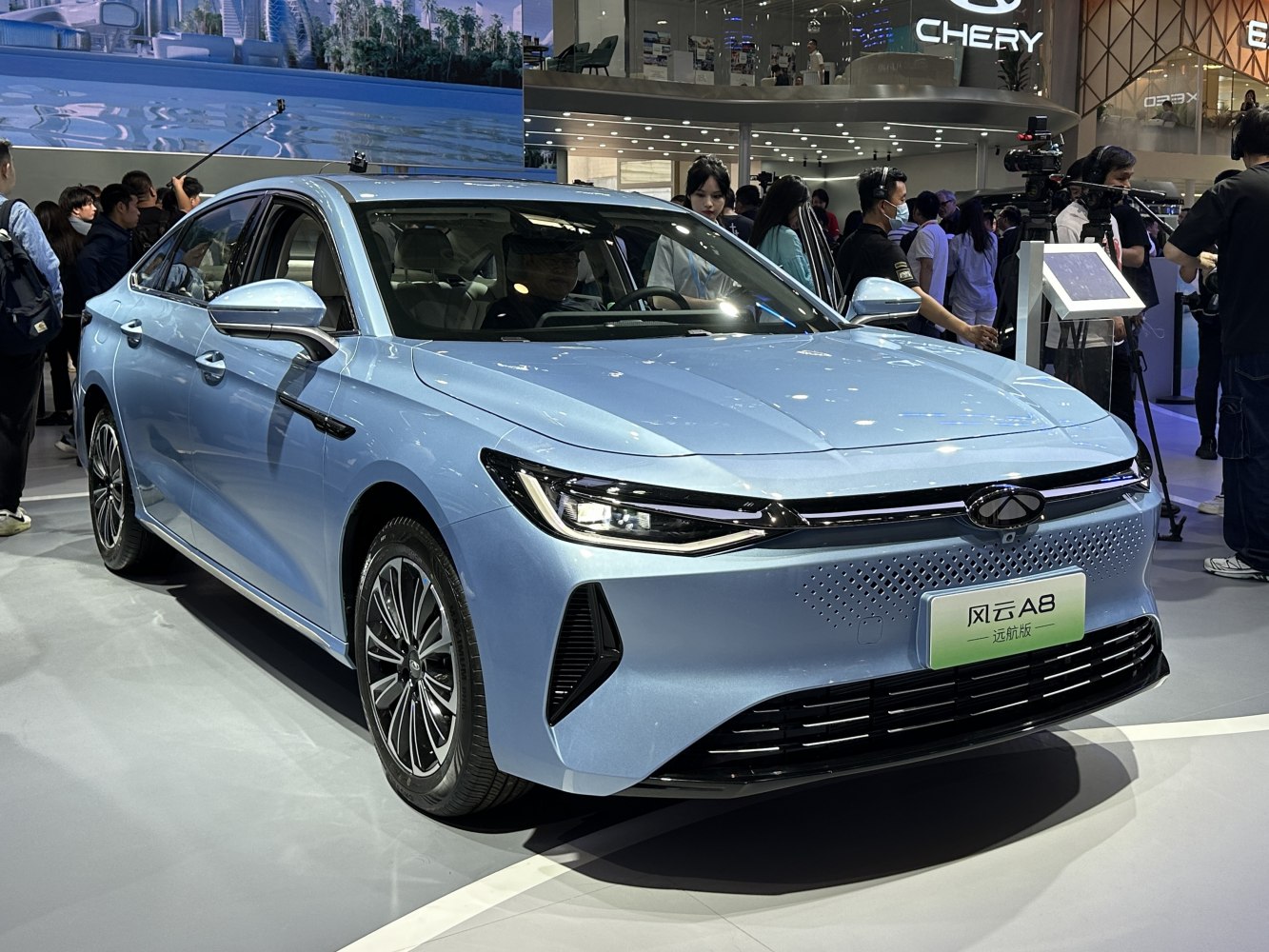 Sleek electric sedan with sharp LED headlights and aerodynamic front design