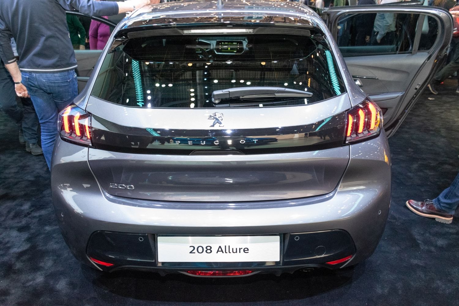 Rear view with distinctive LED tail lights and hatchback design